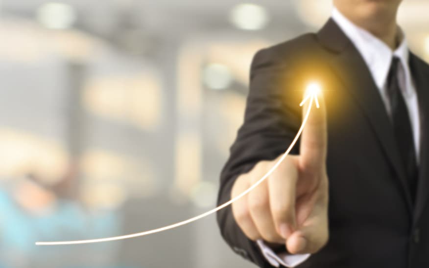 Businessman showing upward trend